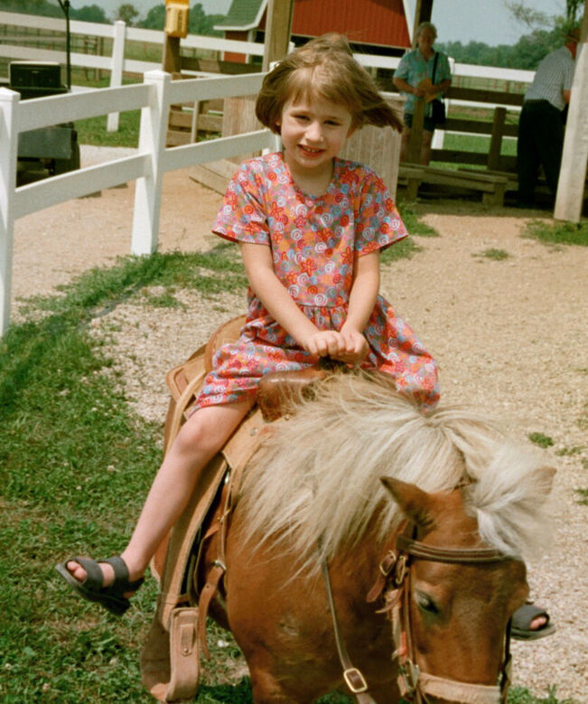 Caeli as a little girl on a pony